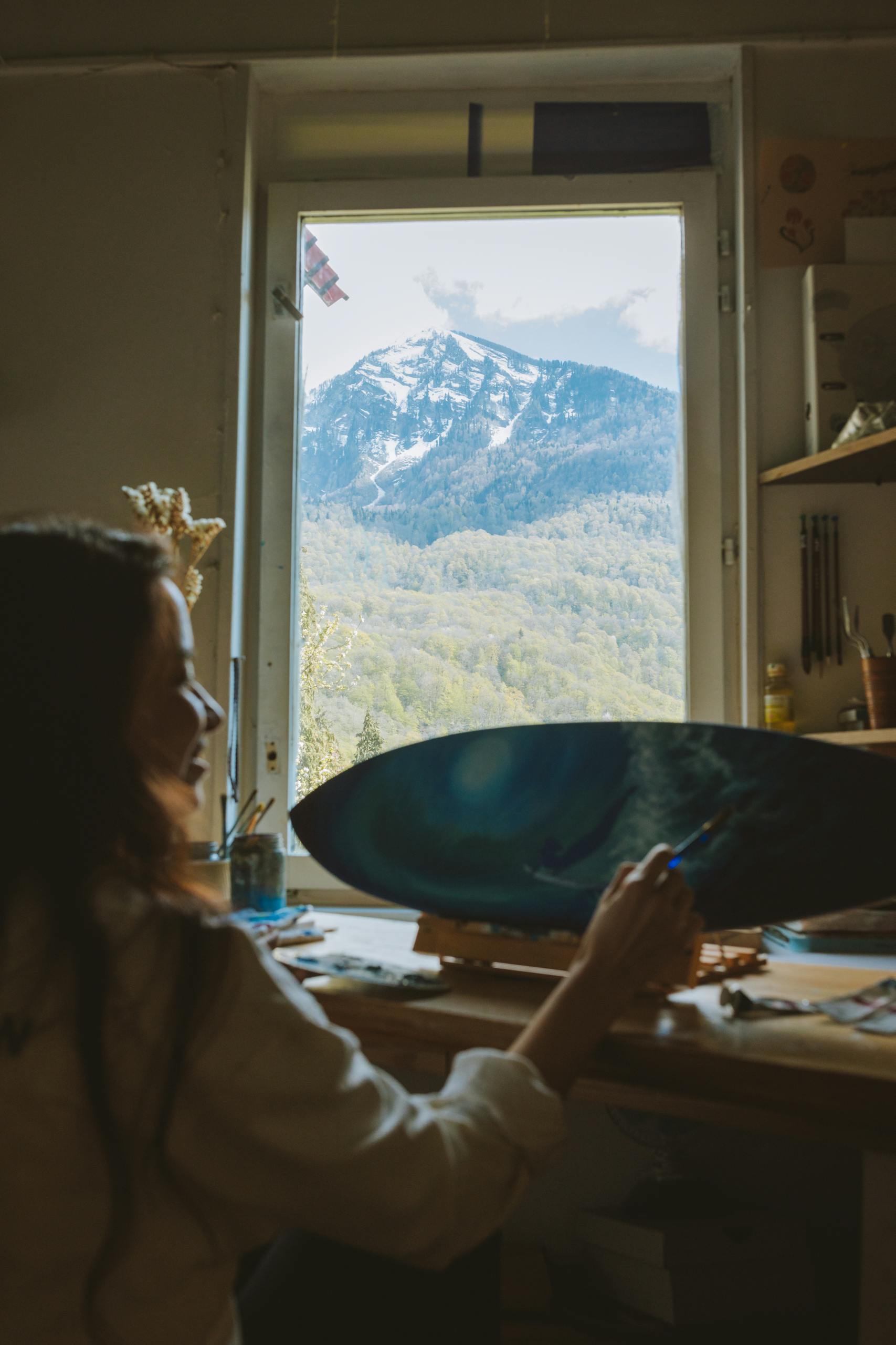 Photo of a Happy Woman Painting